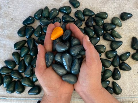 Hands holding tagua nut beads